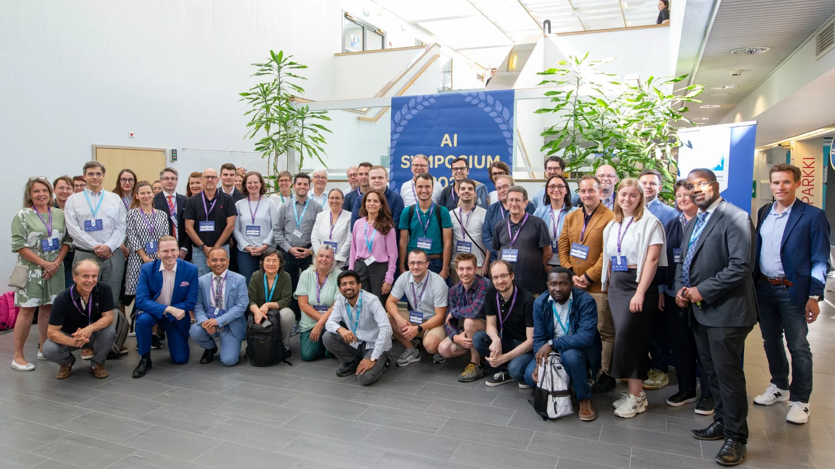 AI symposium group with Paresh Rathod and international participants